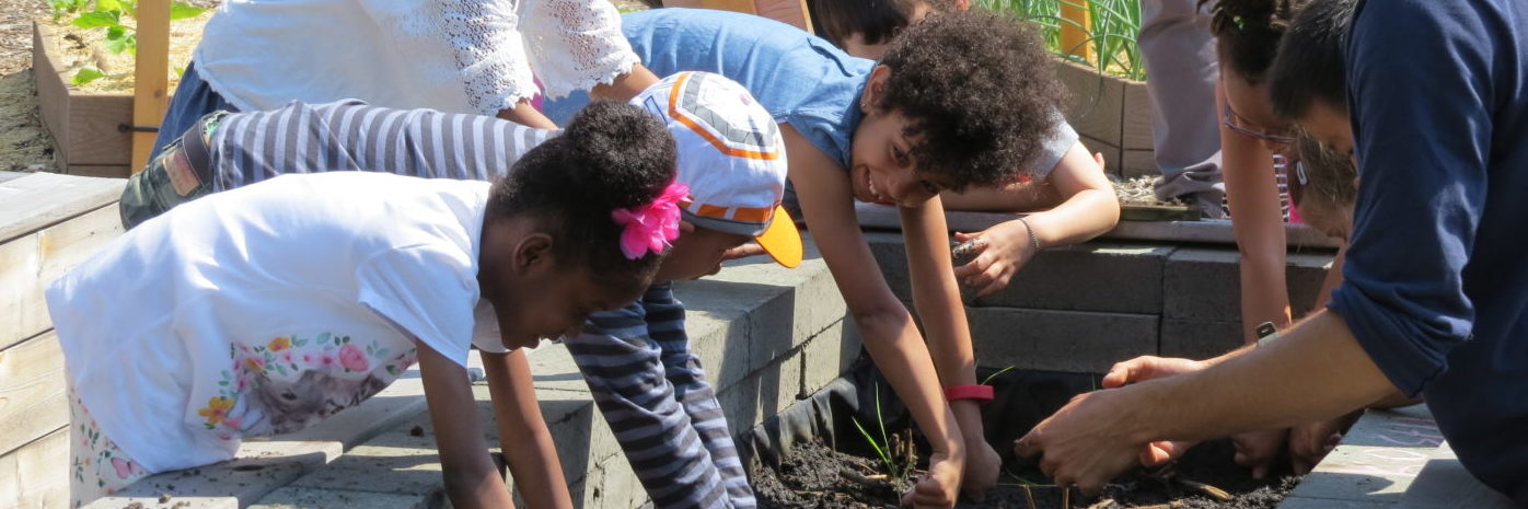 Children gardening with community.
