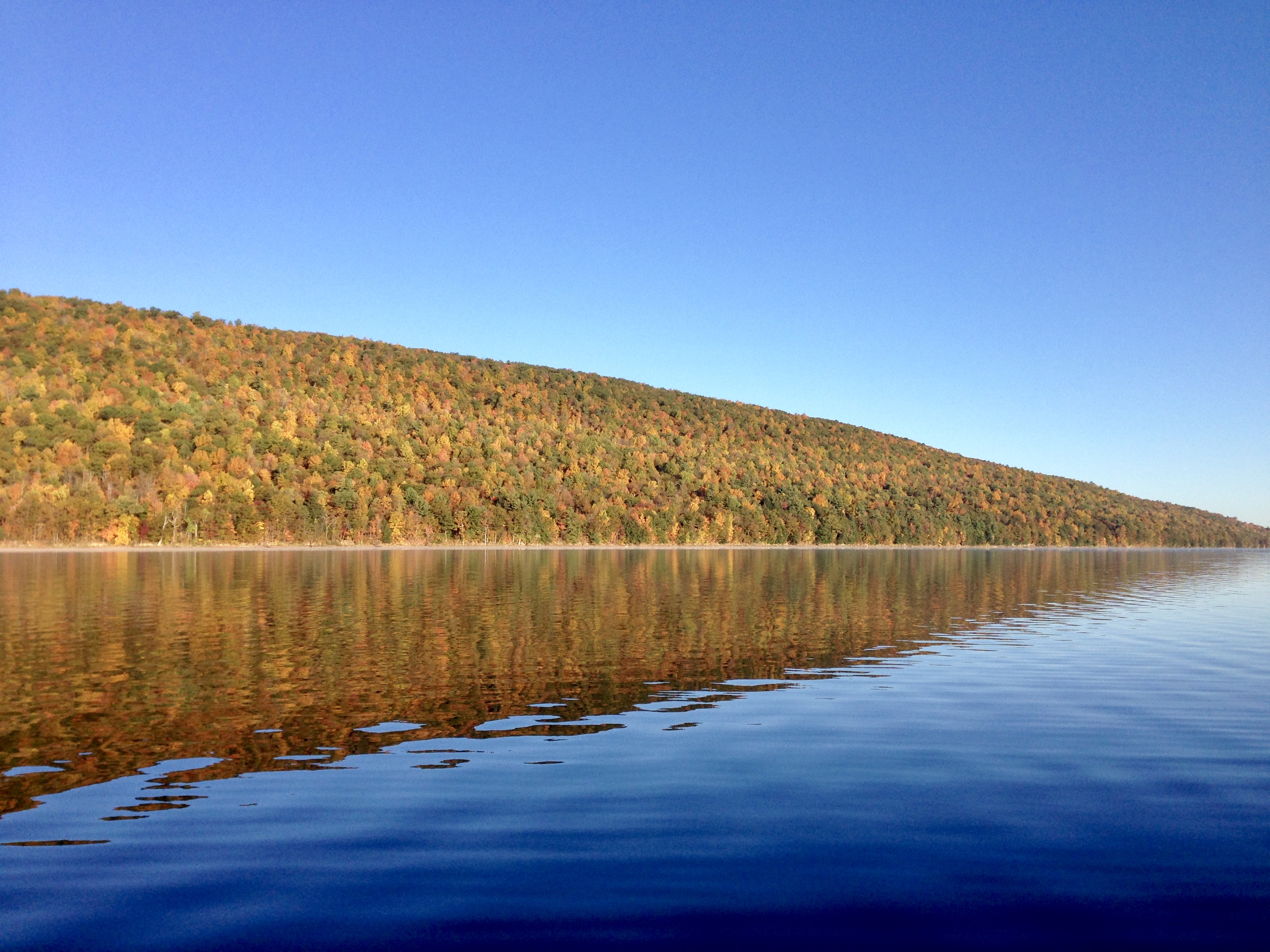 Fall foliage over a lake in the Finger Lakes region of New York State.