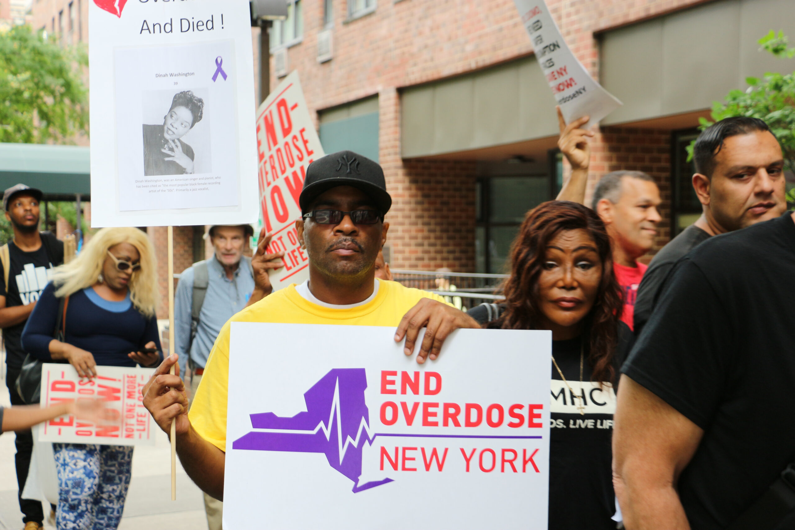 A group of people rallying for ending overdose in New York State.